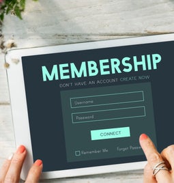 Tablet shows a membership signup form