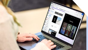 A professional woman working intently on building a website on her laptop.