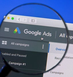 google ads dashboard with magnifying glass over the words google ads